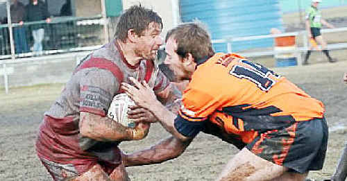 Killarney Cutters forward Shane Frier takes the ball up against the Tenterfield Tigers. Killarney Cutters forward Shane Frier takes the ball up against the Tenterfield Tigers.